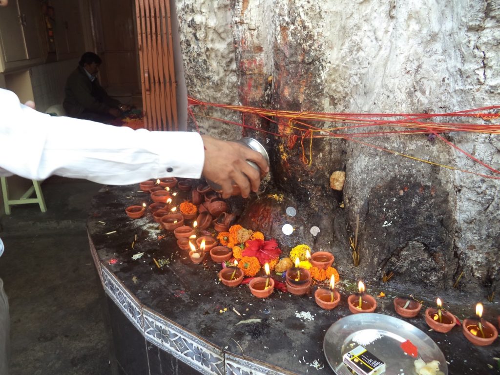 offering mustard oil on shanidev